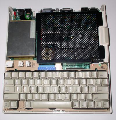 Photo of an Apple IIc with the top half of its case removed.