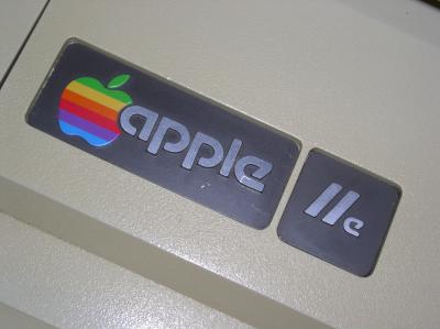 A close-up photo of the Apple IIe's logo.