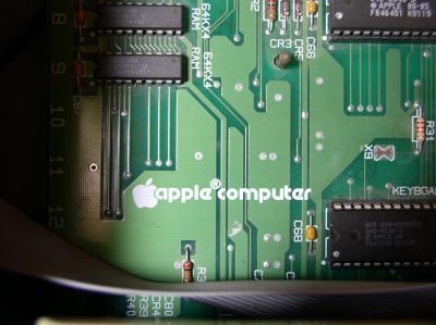 Photo of the Apple logo on the Apple IIe's motherboard.